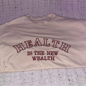 Graphic tees, used,beige shirt is an oversized fit